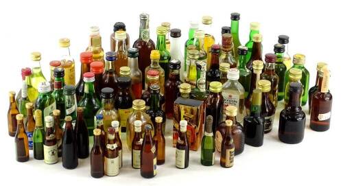 A collection of miniature bottles of whisky and other spirits, etc.