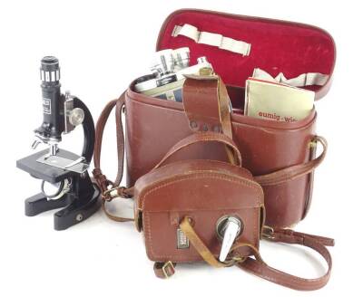 A collection of items, to include a microscope, a Eumig cine camera, etc.