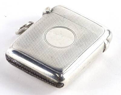 A George V silver Vesta case, with engine turned decoration and a circular vacant cartouche, Chester 1911, 1¼oz.