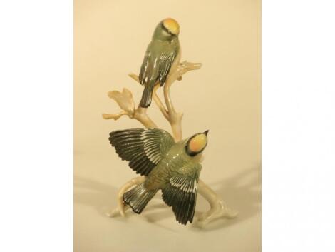 A Karl Ens porcelain group of a pair of gold crests on a branch