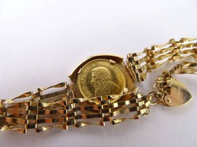 A 9ct gold 1/10th Krugerrand set bracelet, with four row twist bar bracelet, and small heart shaped padlock, set with 1/10 Krugerrand coin dated 1981, 9g. - 2