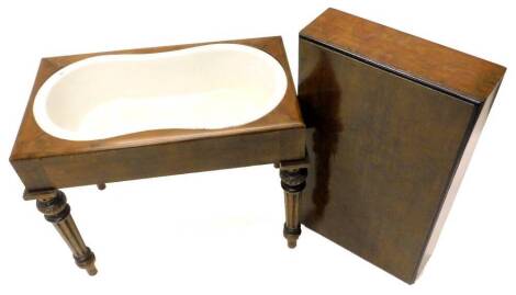 A Victorian birds eye maple and ebonised bidet, the rectangular top enclosing a shaped interior with cream ware insert, indistinctly stamped, but possibly Wedgwood, on fluted turned tapering legs, 61cm L.