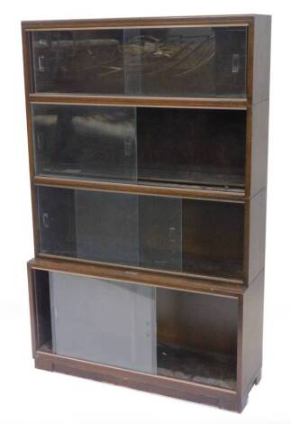 An oak Globe Wernicke type four section bookcase, with sliding glass doors, 89cm W.