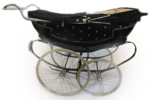 A black and chrome coach built Wilson pram, with attachable bag, etc.