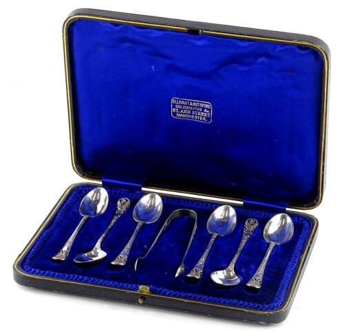 A set of six Edwardian silver teaspoons, each with a pierced handle, decorated wit flowers, etc., and a pair of matching sugar tongs, a label for Olivant and Botsford, Manchester, Sheffield 1906, in a fitted case.