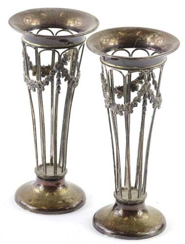 A pair of Edwardian silver vases, each with pierced sides, decorated with swags on a domed foot, lacking liners, Birmingham 1907, 5¾oz.