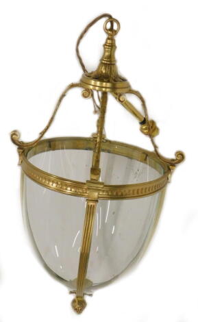 A Victorian style brass hall lantern, with four bowed glass panels and a pineapple finial, 60cm to the top of the fitting.