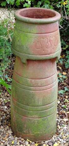 A late 19thC Arts and Crafts terracotta chimney pot, 81cm H.