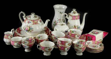 A Royal Albert Lady Carlyle pattern part tea and coffee service, and two Aynsley vases.