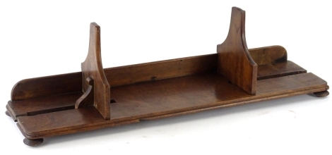 A Victorian adjustable mahogany book plaque, on bun feet, 77cm W.