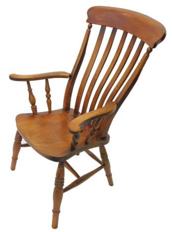 A 19thC beech and elm lathe back open armchair, with a solid seat, on turned legs with H stretcher.