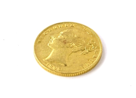 A young Victoria head full gold sovereign, dated 1863.