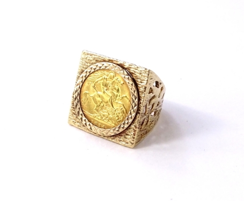 A George V half gold sovereign ring, on chunky 9ct gold frame, with pierced design sides, the sovereign dated 1914, ring size O, 14.2g all in.