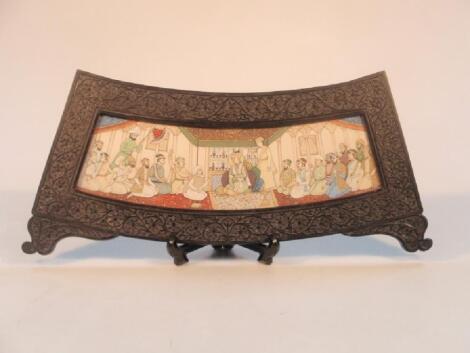 A Indian hand painted plaque of slightly curved form