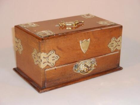 A late Victorian oak smokers chest with patent sliding action to reveal