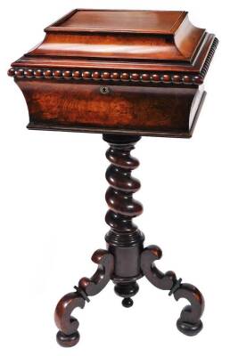 A early Victorian rosewood and mahogany teapoy, the rectangular sarcophagus top with an elongated beaded border, revealing a fitted interior with removable caddy boxes and openings for bowls, on a barleytwist stem terminating in scroll legs on compressed