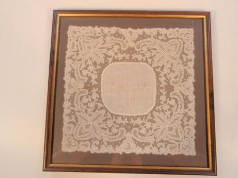 Two delicate framed lace panels or handkerchiefs