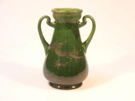 A 19thC cream glazed pottery two-handled vase