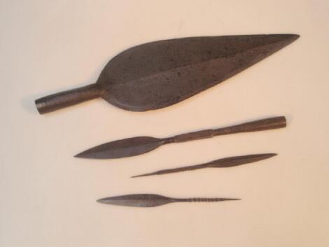 A old large spearhead and three small iron spearheads