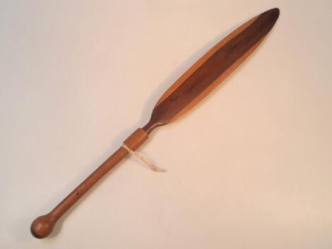 An African hard wood dance paddle with knob handle