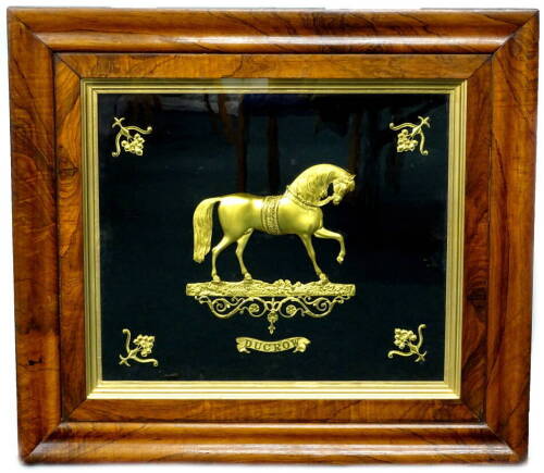 A 19thC gilt metal circus related gilt brass profile of a horse, on a shaped base, titled Ducrow, within a contemporary moulded rosewood frame, 76cm H, 86cm W. Andrew Ducrow (1793-1842) was a British circus performer and often called the Father of British