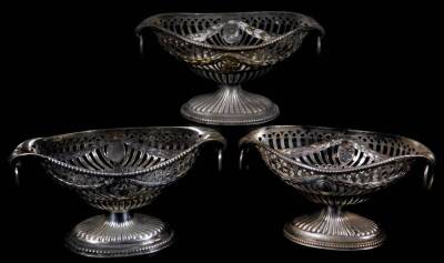 Three similar open silver salts, to include London 1891, of ellipse form, with drop ring handles, on circular stems and oval part gadrooned feet each with a bead outline, London 1891, etc. 13cm W, one unmarked, 8oz all in. (3)