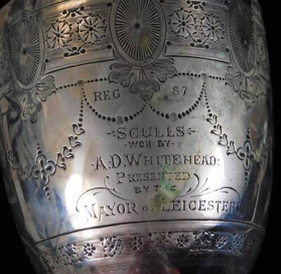 Withdrawn Pre-Sale by vendor A Victorian silver goblet, the egg shaped bowl on and inverted stem and circular bead lined foot, heavily chased with a repeat geometric and floral pattern, engraved Reg 87 Sculls, won by A D Whitehead, presented by The Mayor - 2