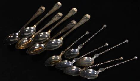 A set of six Edwardian silver teaspoons, old English pattern, partially engraved, 12cm W, Sheffield 1902, a further set of silver teaspoons with orb finials and twist stems, 5oz all in. (a quantity)