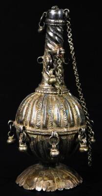 An Eastern perfume bottle, with cylindrical turned neck and bulbous body, on inverted stem and floral base with stopper, possibly Indian, white metal, 11cm H.