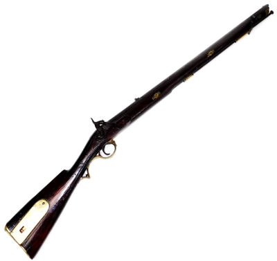 An early 19thC 1837 British Colonial .704 two groove percussion rifle, with walnut stock and brass mounts, 118cm W.