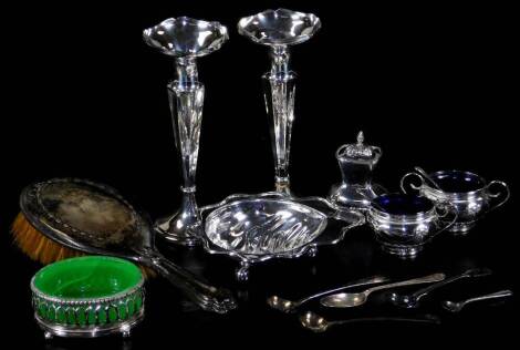 Various silver, silver plated ware and other items, a pair of weighted candlesticks with flared rims, tapering bodies and circular feet, 17cm H, part cruet set, a George V hairbrush, Chester 1913, etc. (a quantity)