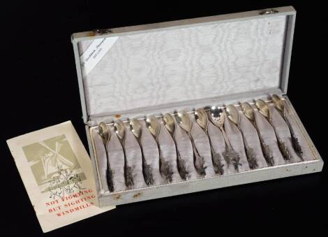 A cased set of twelve Not Fighting But Sighting Windmill teaspoons, each with Philips marking. (12, cased)