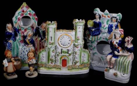 Various 19thC and other pottery, comprising of a Staffordshire pottery watch group, 27cm H, set with three figures, polychrome decorated predominately in orange, blue, pink and green, another similar set with two figures, a castle clock group, a figure gr