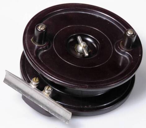 A 20thC Allcock Aerialite Bakelite fishing reel, of circular form, with chrome coloured mounts, 10cm H.