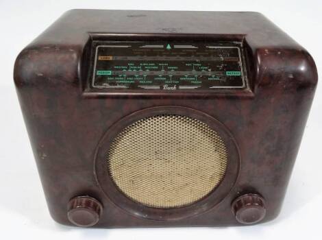 A mid 20thC Bush DAC90A Bakelite cased radio, of rectangular form, with mesh work speaker and front tuning knops, 30cm W.