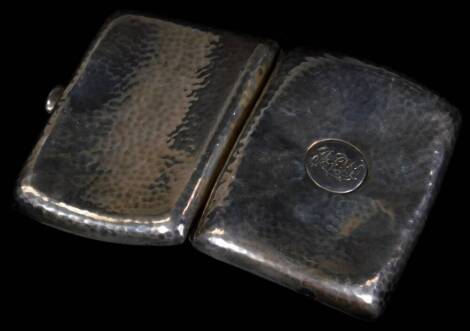 An Edwardian silver cigarette case, of shaped rectangular form, with thumb mould handle, engine turned with initialled cartouche, double strap interior, Birmingham 1907, 8cm W, 2oz.