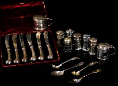 Various silver cruet items, pepper pots, mustard pot, salt of cylindrical form, 6cm H, some with liners, Birmingham 1925, etc. various preserve spoons and a cased set of six silver handled pistol grip knives 11oz of silver. (a quantity)