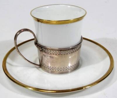 A cased set of six Shelley late Foley gilt rimmed coffee cups and saucers, by Mappin & Webb, with silver mounts, loop handles, upper and lower pierced banding, Sheffield 1913. - 2