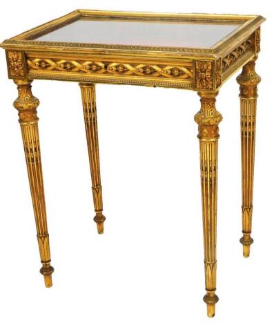 A 19thC style French gilt wood bijouterie cabinet, of rectangular form, with a heavily carved border, with raised frieze on turned cylindrical legs heavily carved with acanthus leaves, 75cm H, 65cm W, 48cm D.