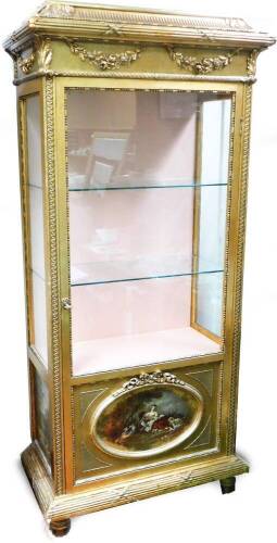 A French Louis XVI style gilt wood display cabinet, with caddy top, horizontal moulded frieze broken by ribbons and an upper raised garland, above a glazed door with side panels, a further panel decorated with Vernis Martin style decoration, with figures