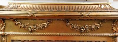 A French Louis XVI style gilt wood display cabinet, with caddy top, horizontal moulded frieze broken by ribbons and an upper raised garland, above a glazed door with side panels, a further panel decorated with Vernis Martin style decoration, with figures - 3