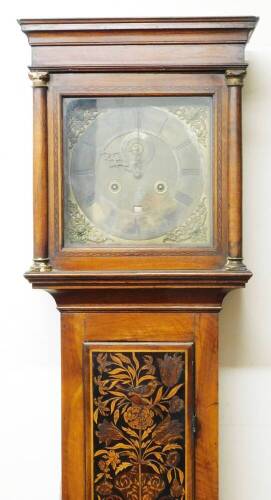 Joseph Saer, Perpoole Laine, London. A Queen Anne provincial walnut and marquetry inlaid longcase clock, with square hood, long trunk door with oval glass, heavily inlaid with birds, vases and flowers, on a similar designed base, 26cm W dial with raised