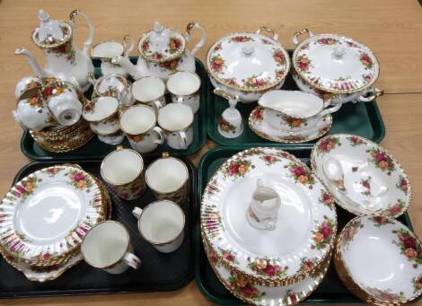 A comprehensive Royal Albert Old Country Roses part dinner service, to include a pair of lidded tureens, 31cm W, gravy boat on stand, teapot, cups, saucers, hand bell, dinner plate, serving plate, coffee pot, oval vegetable dish, etc. printed marks beneat