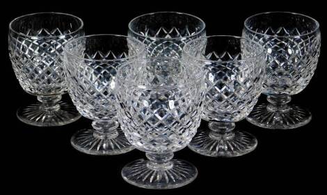 A set of six 20thC hobnail cut crystal glass drinking glasses, with wide bell shaped bowls, compressed stems and circular feet, Waterford style but unmarked, 12cm H.