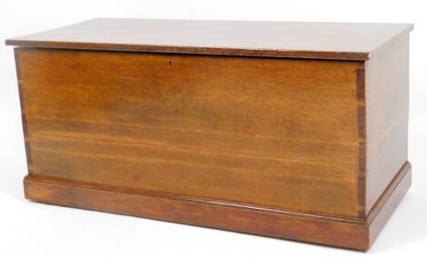 An early 20thC oak stained blanket box or tool chest, of rectangular form, with visible dovetails, on a block base, 52cm H, 109cm W, 48cm D.