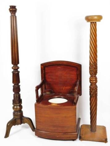 An early 20thC mahogany torchere, with acanthus leaf stem, on triple supports, and another with turned stem, on square base with canted corners, 140cm H, the top 20cm Dia and a box commode of D-end outline. (3)