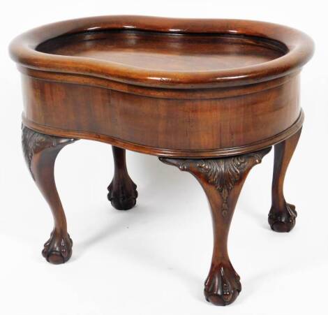 A mahogany Chippendale design bidet, of shaped form with hinged lid, shallow well and heavily carved ball and claw feet, 46cm H, 63cm W, 49cm D.