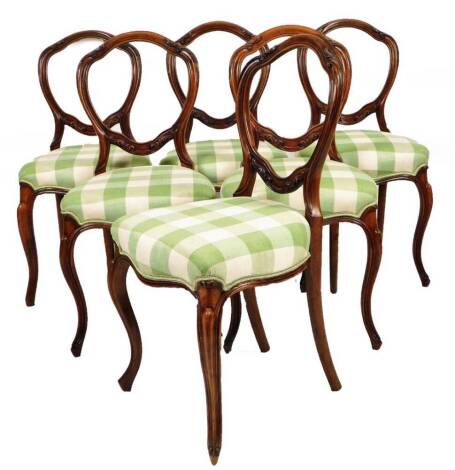 A set of six late 19thC walnut balloon back salon chairs, each with shaped horizontal splats, overstuffed seats in later check material and front sabre legs, 80cm H. (6)