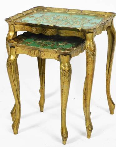 A nest of two lacquered tables, each moulded top set with scrolls on a turquoise and gilt coloured ground, on cabriole legs terminating in cylindrical feet, the largest 50cm H, 43cm W, 32cm D. (2)