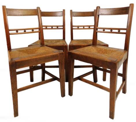 A set of four 19thC oak, elm and rush seated dining chairs, with horizontal orb splats, drop in seats and square tapering front legs joined by H stretchers, 88cm H. (4)